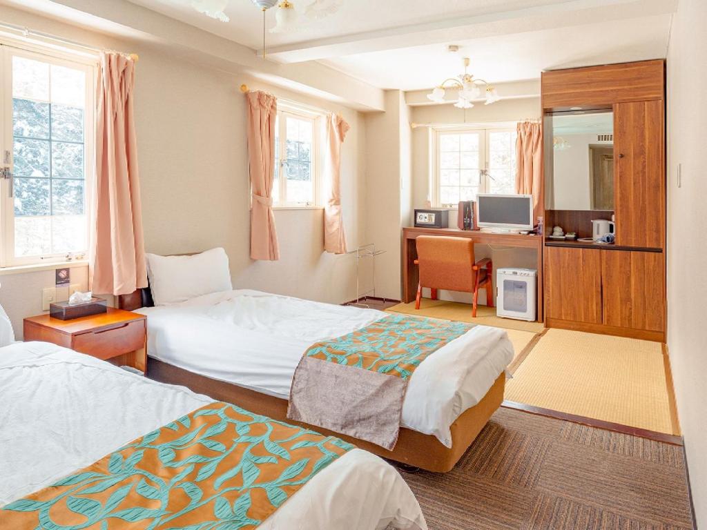 Krevet ili kreveti u jedinici u okviru objekta Hakuba Sun Valley Hotel Annex - Vacation STAY 90351v