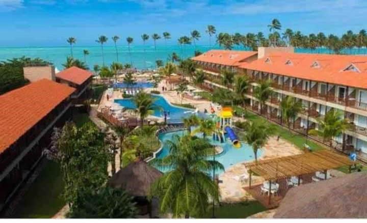 an aerial view of a resort with a water park at Apart Resort Beira Mar Mutá - PS in Porto Seguro