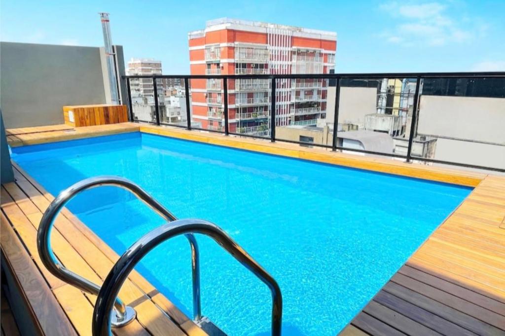 a swimming pool on the roof of a building at Apartamento Familiar en Palermo, Buenos Aires Argentina in Buenos Aires