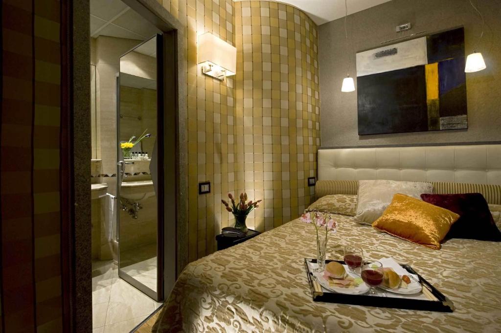 Postel nebo postele na pokoji v ubytování Duca d'Alba Hotel - Chateaux & Hotels Collection