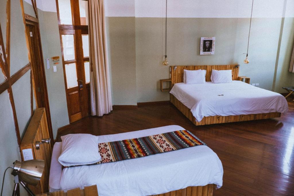 Postel nebo postele na pokoji v ubytování Viajero Quito Hostel