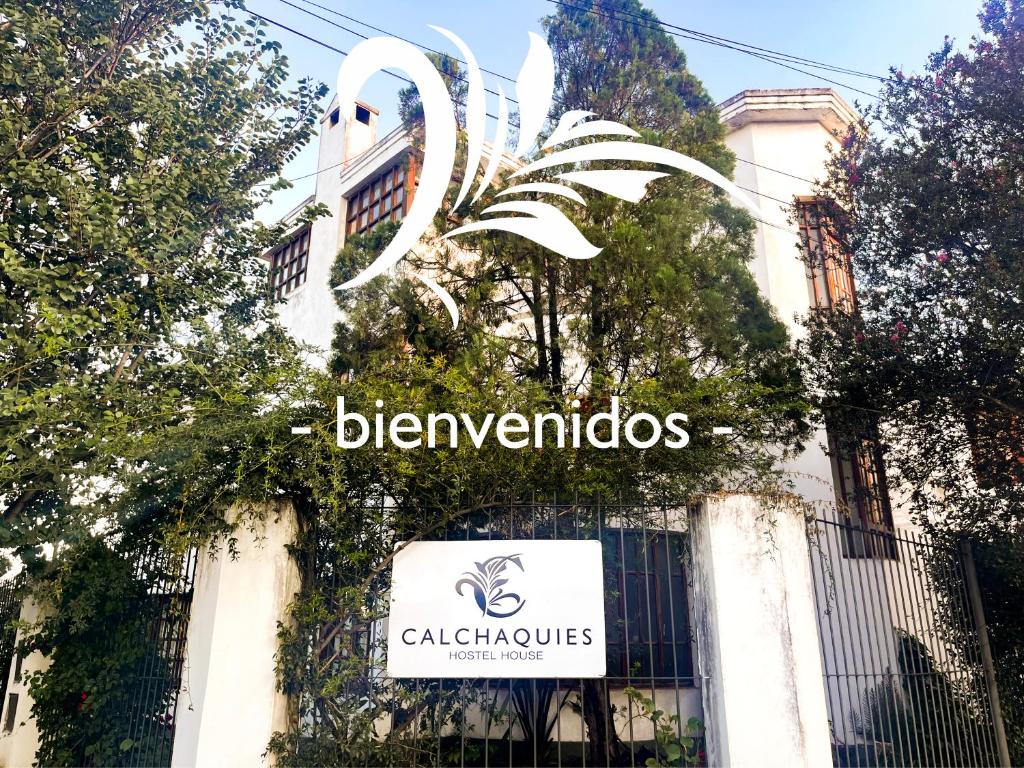 a sign for a building with a sign for the blenheimolis calat at Calchaquíes Home Hostel in San Salvador de Jujuy