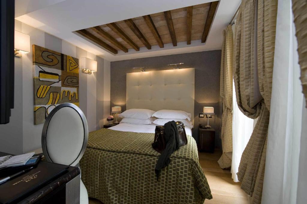 Postel nebo postele na pokoji v ubytování Duca d'Alba Hotel - Chateaux & Hotels Collection