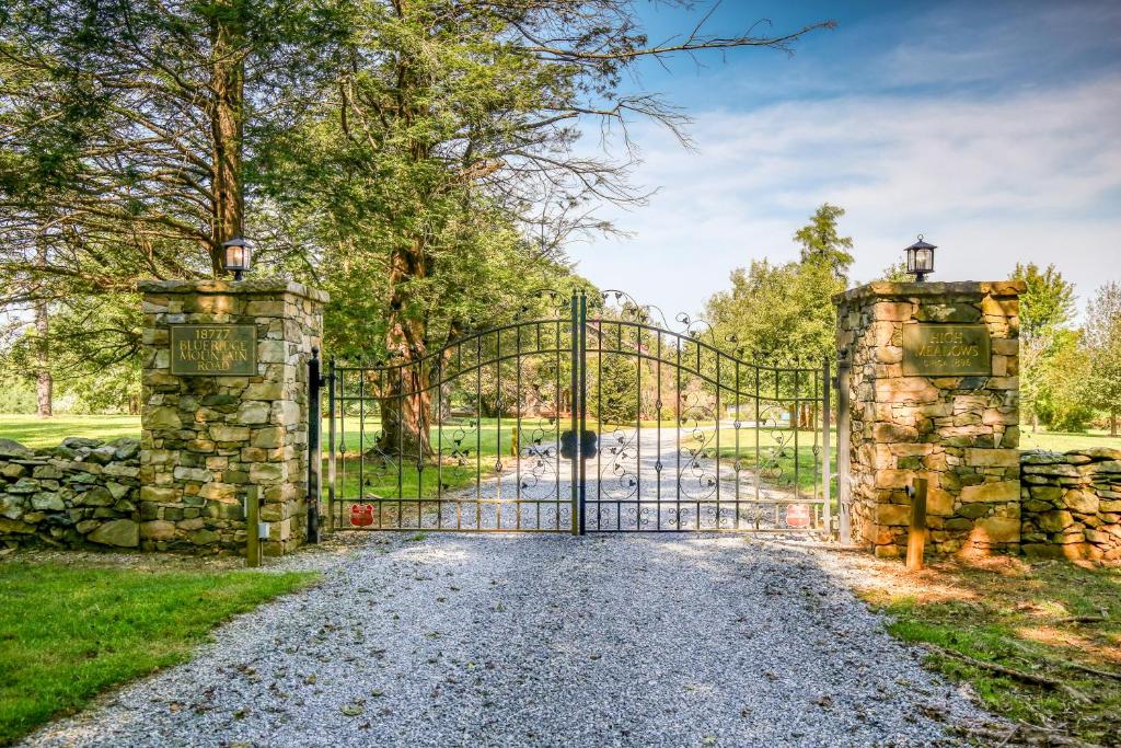 an entrance to a gate into a stone fence at High Meadows Estate in Purcellville