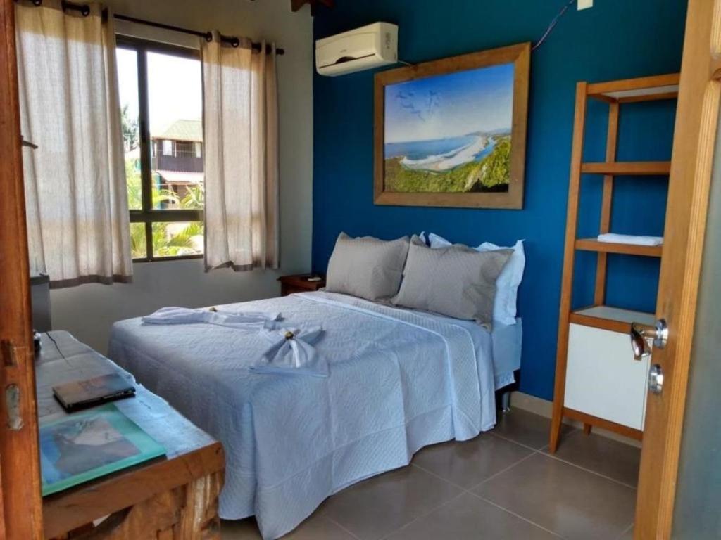 A bed or beds in a room at Essência da Guarda Surf House