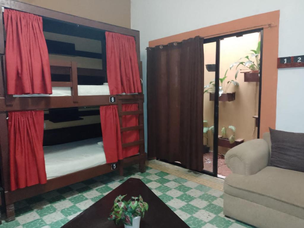 Postel nebo postele na pokoji v ubytování Casa Bonita Hotel y Hostal