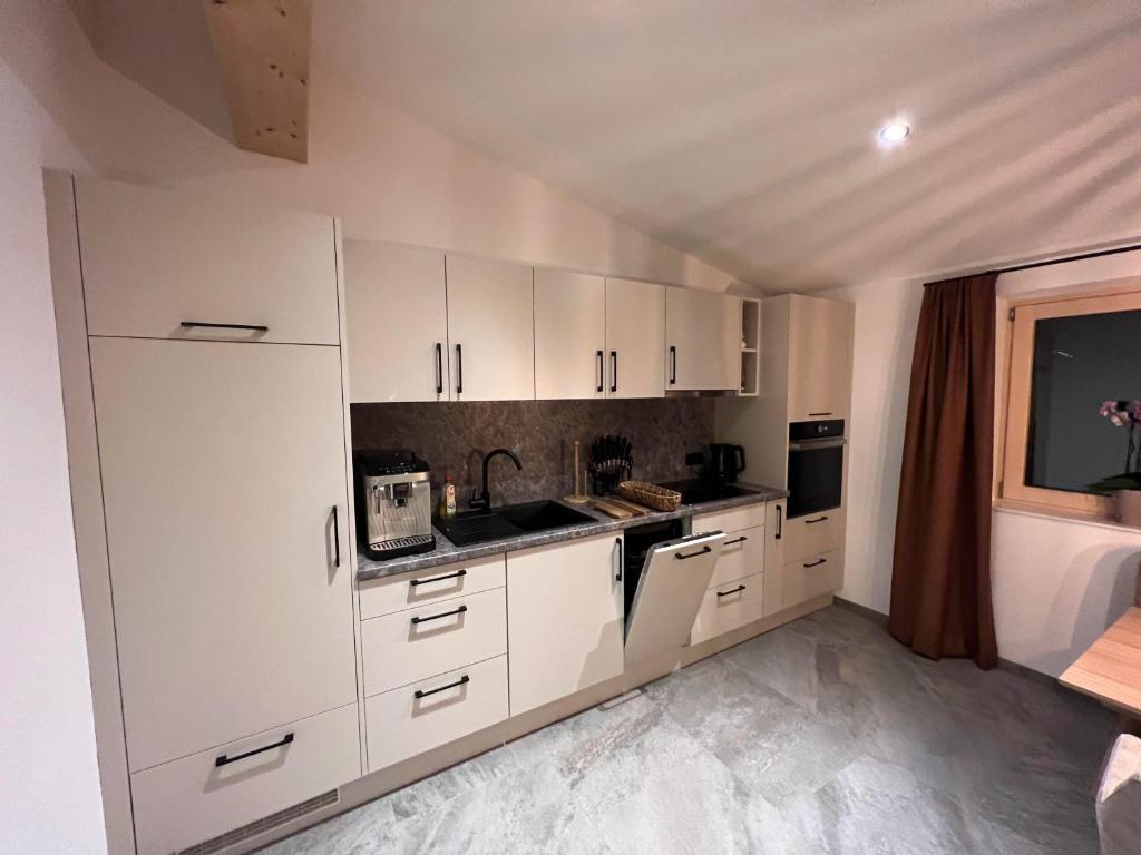 Kuchyň nebo kuchyňský kout v ubytování Appartements Plus