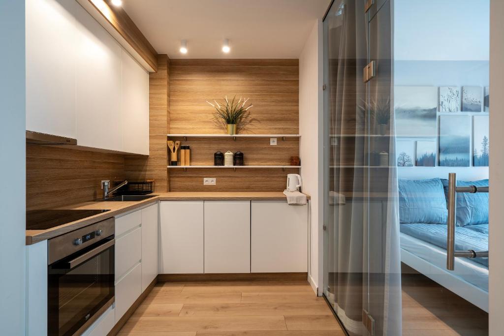 Η κουζίνα ή μικρή κουζίνα στο Old Bank Apartment