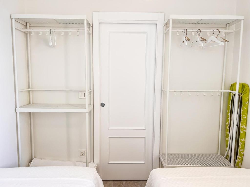 Postel nebo postele na pokoji v ubytování Tarifa Cozy House PALM BEACH