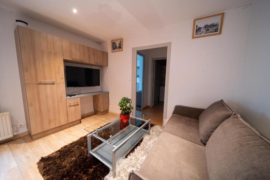 Telewizja i/lub zestaw kina domowego w obiekcie Appartement haut de gamme Centre ville