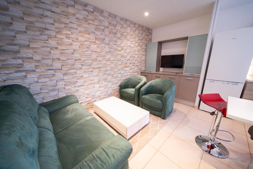 Telewizja i/lub zestaw kina domowego w obiekcie Appartement haut de gamme Centre ville