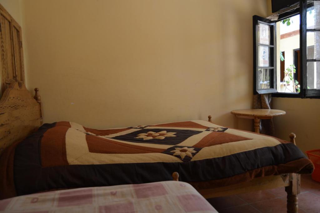 Hostal Coronel Pedro Arraya客房内的一张或多张床位