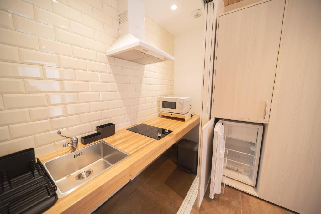 Kuchyňa alebo kuchynka v ubytovaní APARTAMENTOS CASA ARADIÑA