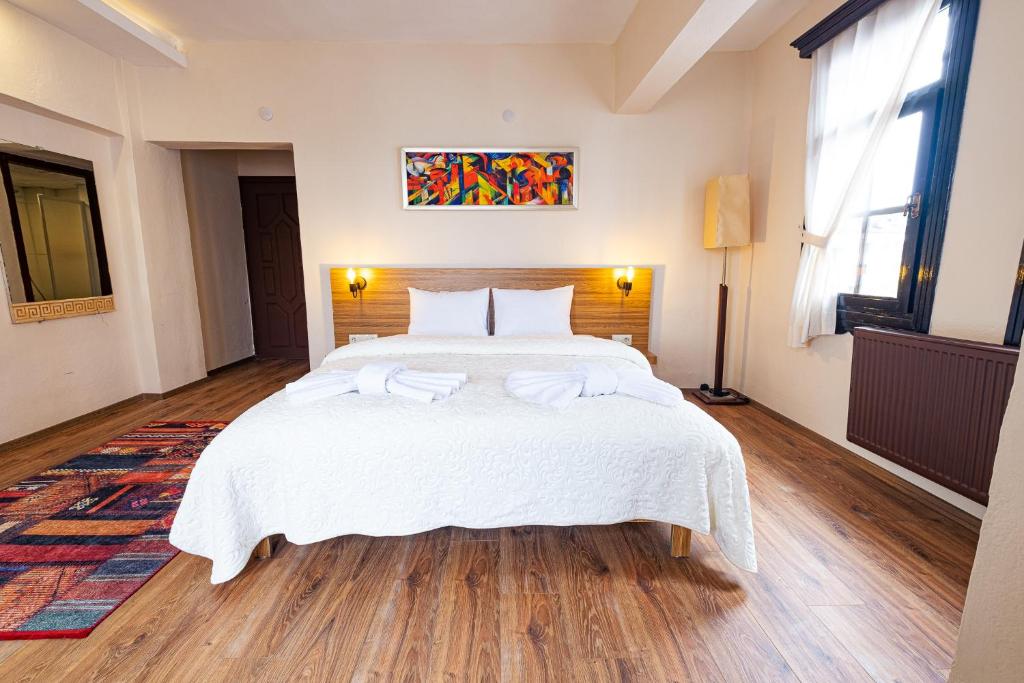 Postel nebo postele na pokoji v ubytování Simre Inn Hotel Safranbolu