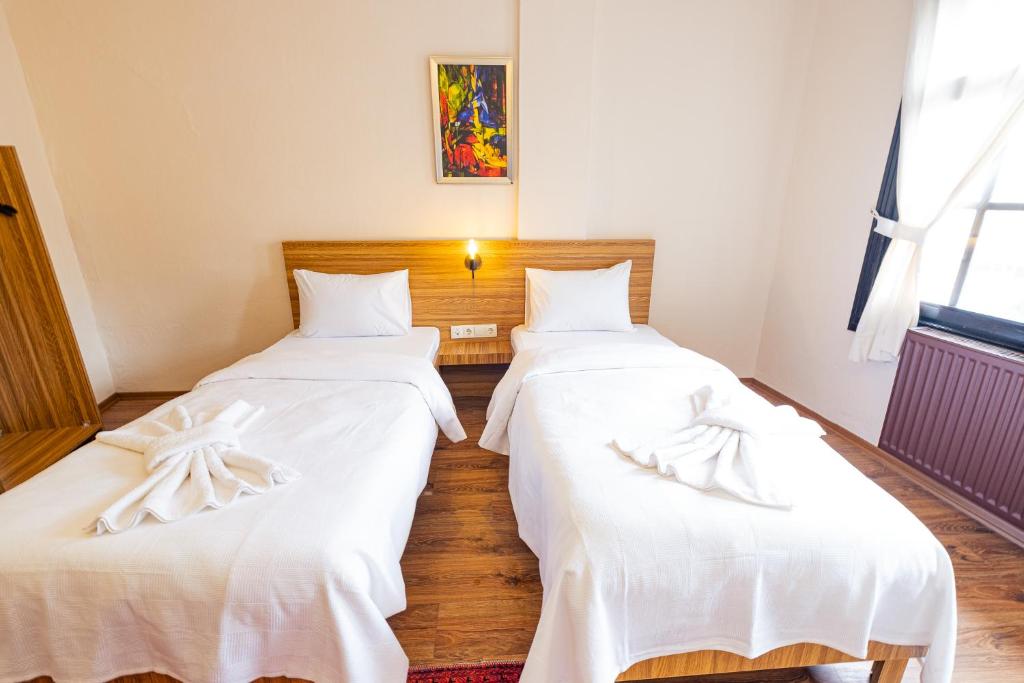 Postel nebo postele na pokoji v ubytování Simre Inn Hotel Safranbolu