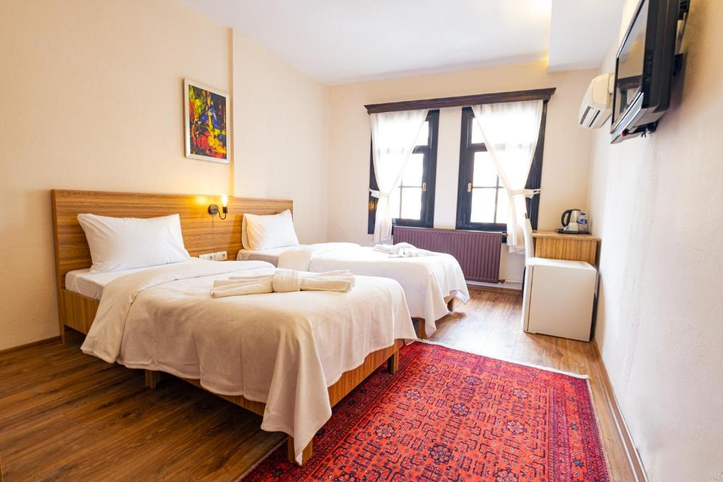 Postel nebo postele na pokoji v ubytování Simre Inn Hotel Safranbolu
