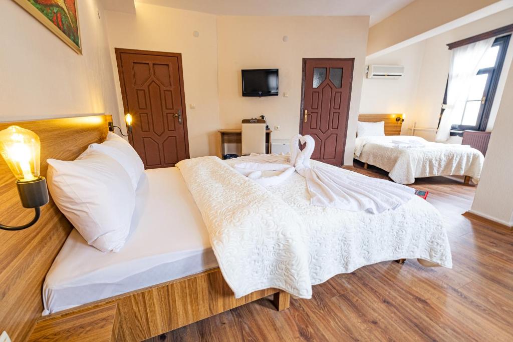 Postel nebo postele na pokoji v ubytování Simre Inn Hotel Safranbolu