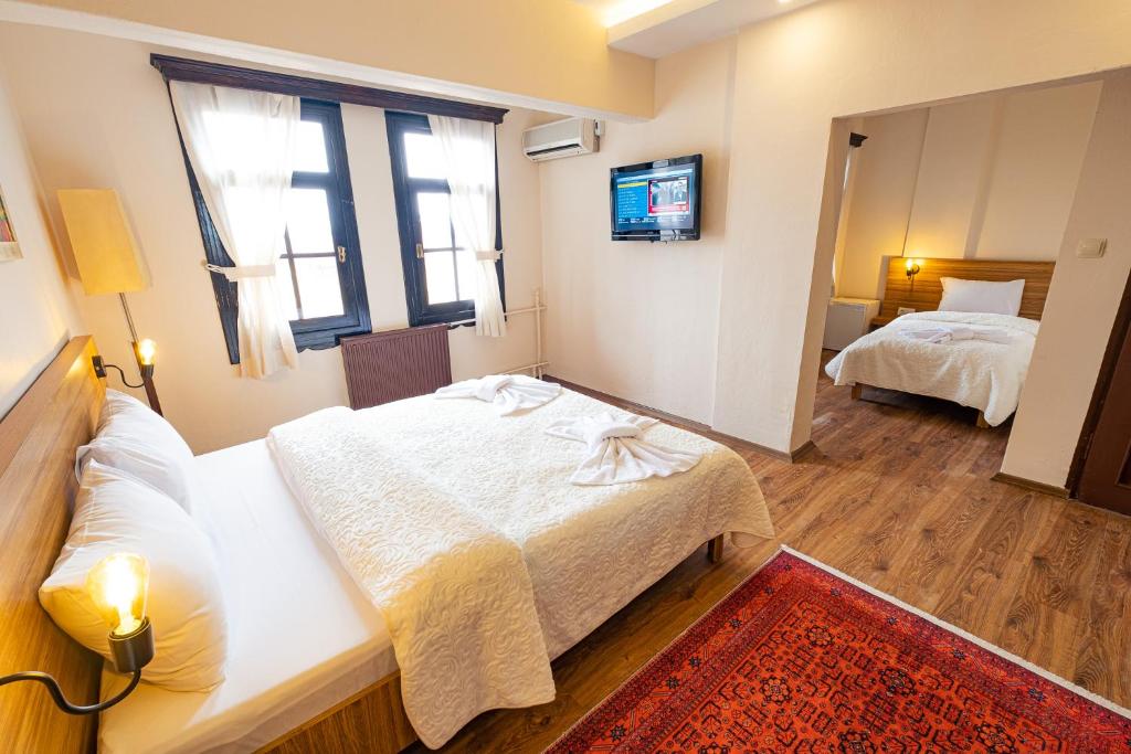 Postel nebo postele na pokoji v ubytování Simre Inn Hotel Safranbolu