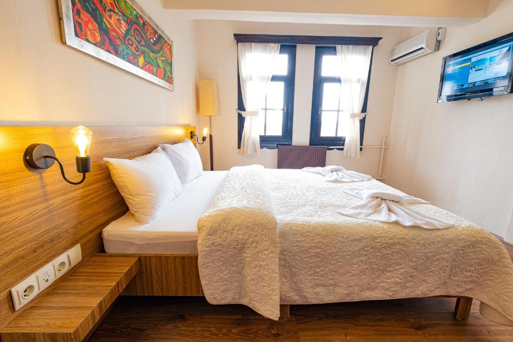 Postel nebo postele na pokoji v ubytování Simre Inn Hotel Safranbolu