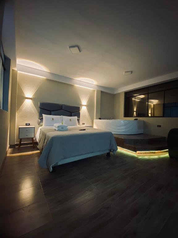 Postel nebo postele na pokoji v ubytování HOTEL MAR Y LAGO