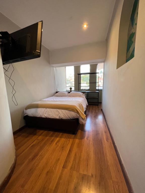 Postel nebo postele na pokoji v ubytování Hostal María Angola