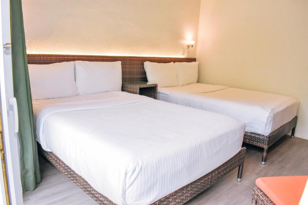 Postel nebo postele na pokoji v ubytování Golden Sands Destination Resorts