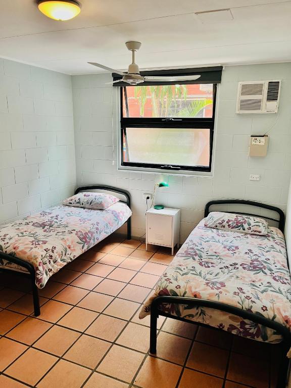 Postel nebo postele na pokoji v ubytování Dreamtime Hostel