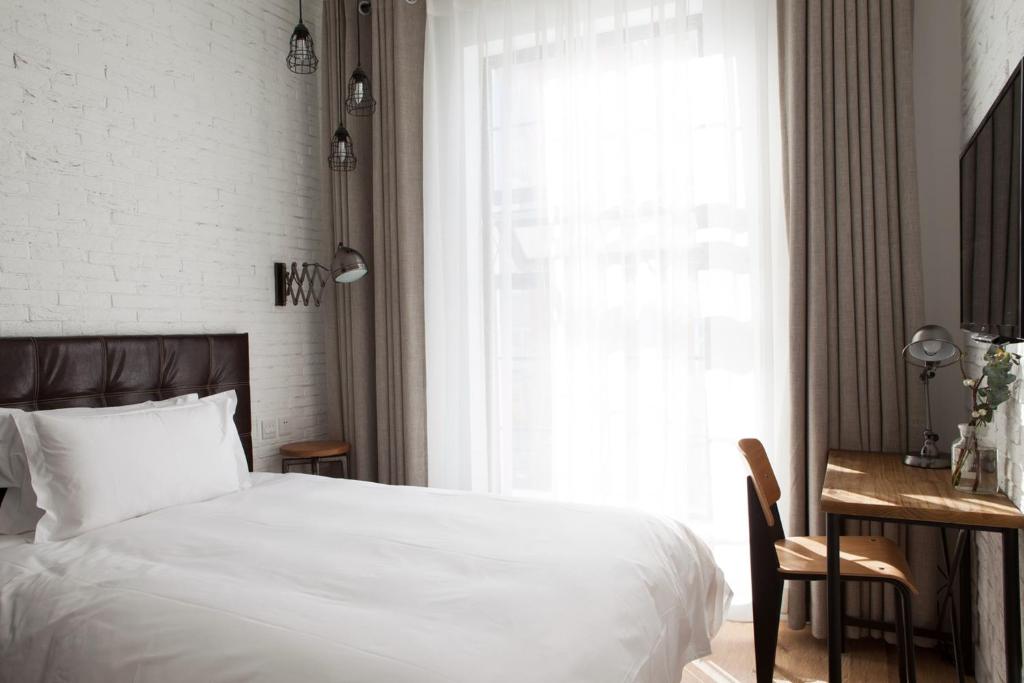 Postel nebo postele na pokoji v ubytování Yi Stack Hotel Beijing