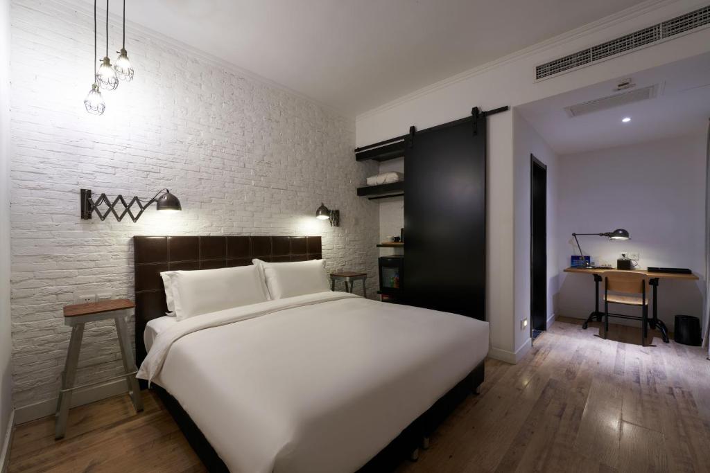 Postel nebo postele na pokoji v ubytování Yi Stack Hotel Beijing