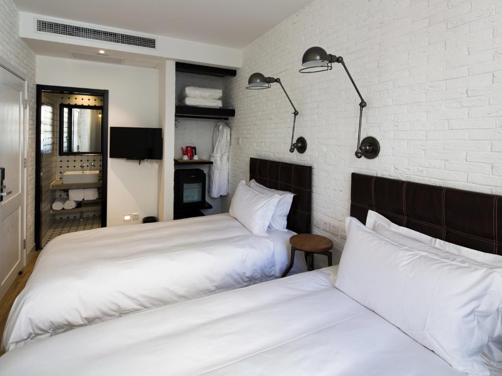 Postel nebo postele na pokoji v ubytování Yi Stack Hotel Beijing