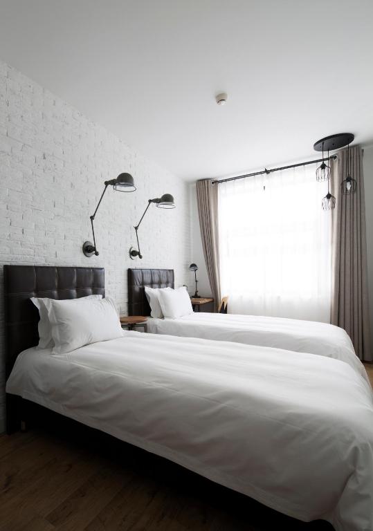 Postel nebo postele na pokoji v ubytování Yi Stack Hotel Beijing