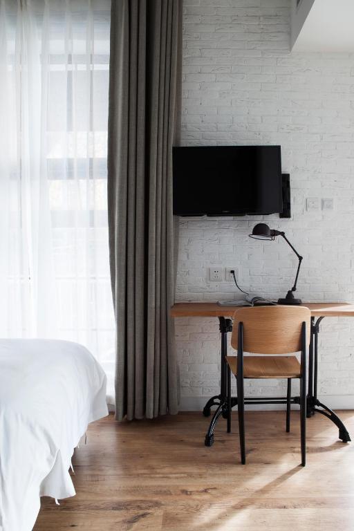 TV a/nebo společenská místnost v ubytování Yi Stack Hotel Beijing