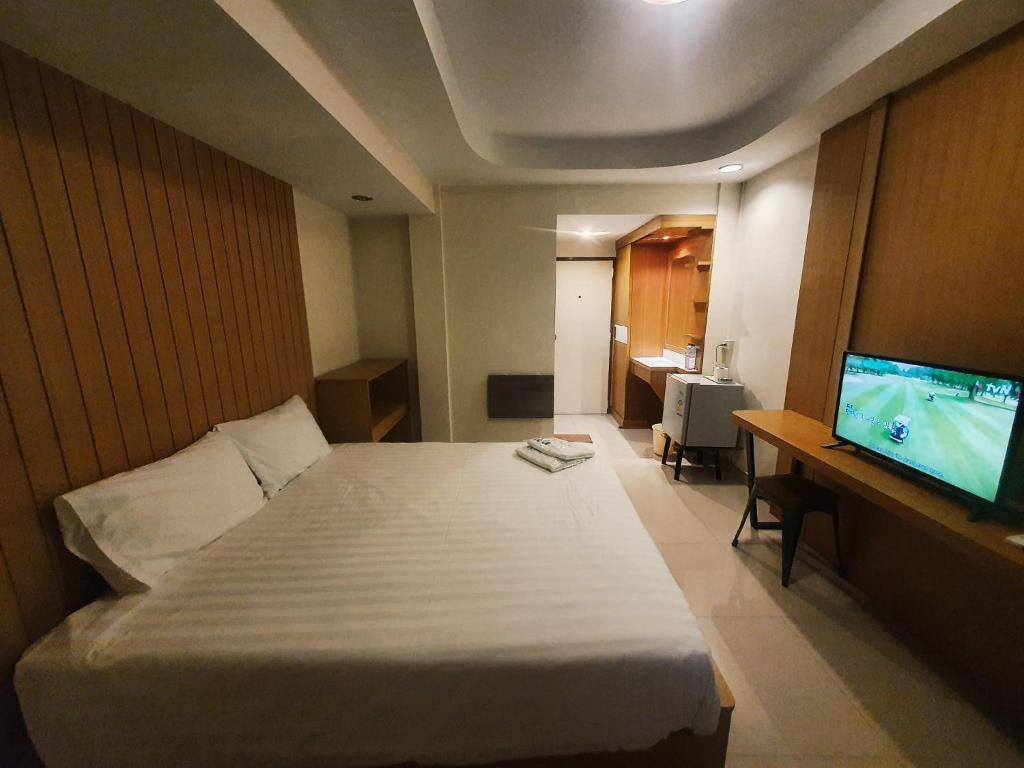 Cama o camas de una habitación en PN Inn Hotel Pattaya