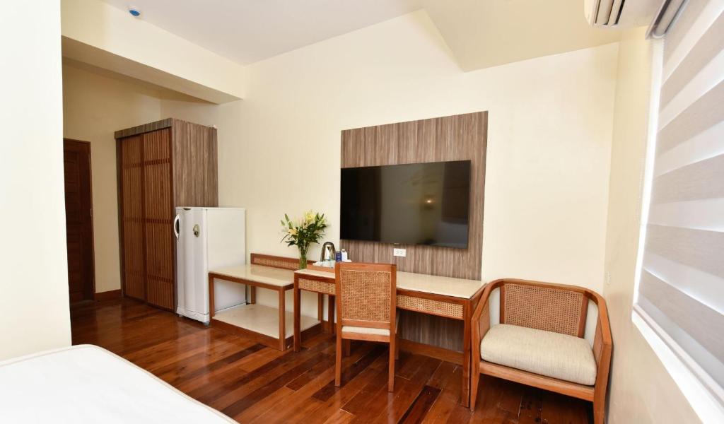 Kabayan Hotel Pasayにあるテレビまたはエンターテインメントセンター