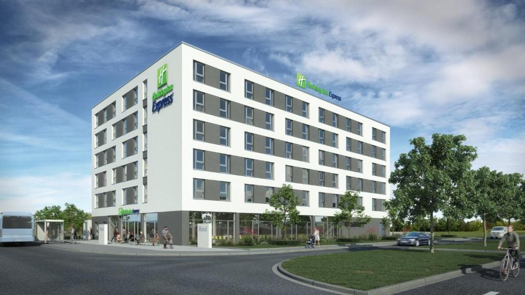 eine Darstellung eines weißen Gebäudes in der Unterkunft Holiday Inn Express - Krefeld - Dusseldorf, an IHG Hotel in Krefeld