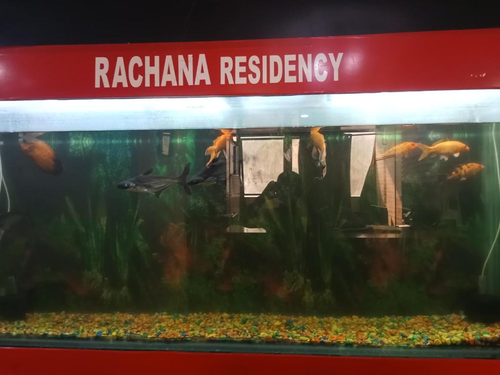 a tank of an aquarium with fish in it at Hotel Rachana Residency in Pune