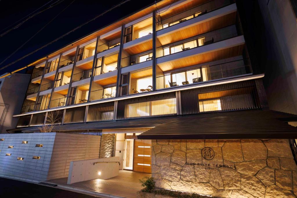 a tall building with lights on in front of it at Gion Elite Terrace in Kyoto