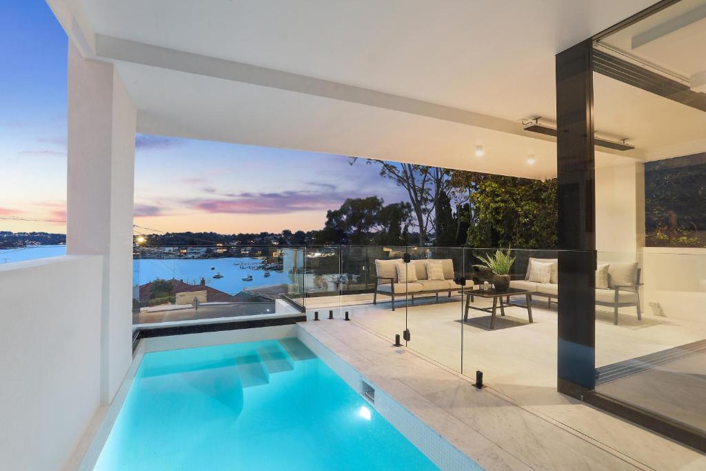 an image of a house with a swimming pool at Luxury Waterside Home in Sydney