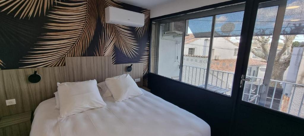 Postel nebo postele na pokoji v ubytování O'Cub Hotel