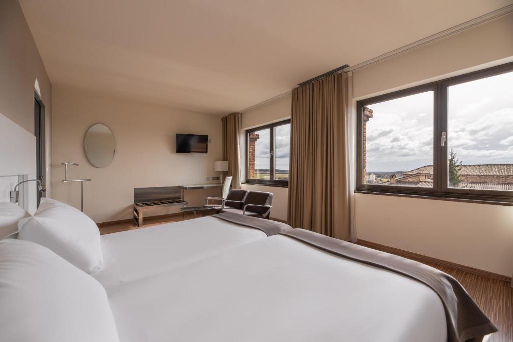 A bed or beds in a room at Eurostars Vía de la Plata