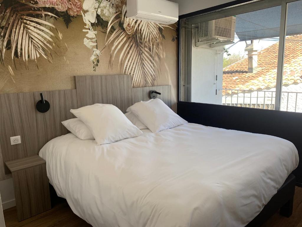 Postel nebo postele na pokoji v ubytování O'Cub Hotel