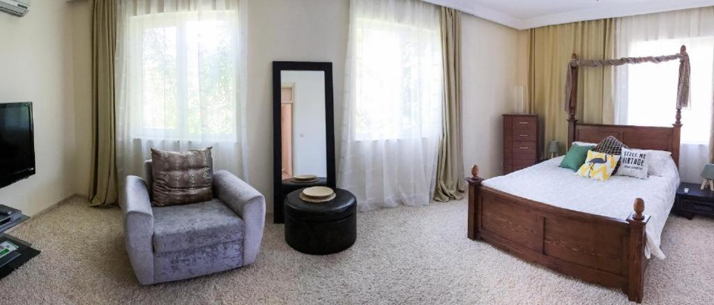 Postel nebo postele na pokoji v ubytování Sofia Residence