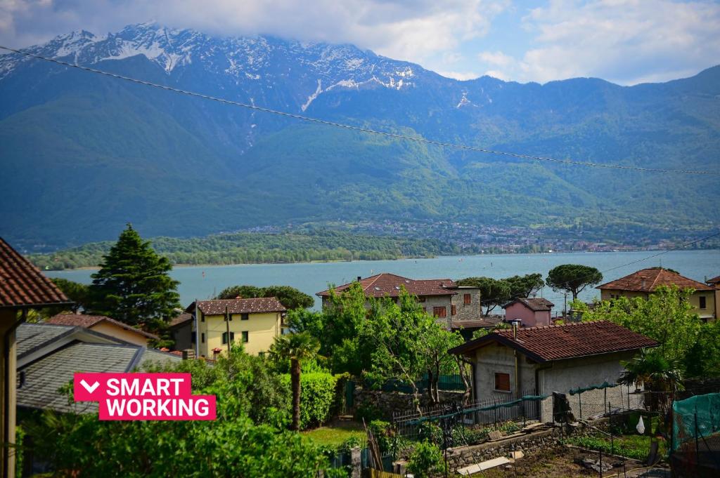 a view of a town with a lake and mountains at Casa Alex by Wonderful Italy in Gera Lario