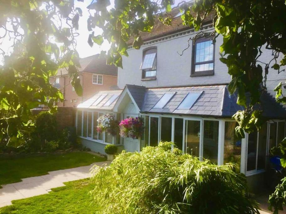 a house with solar panels on the front of it at HENWICK HOUSE Beautiful flat,Private parking, short walk to town in Ludlow