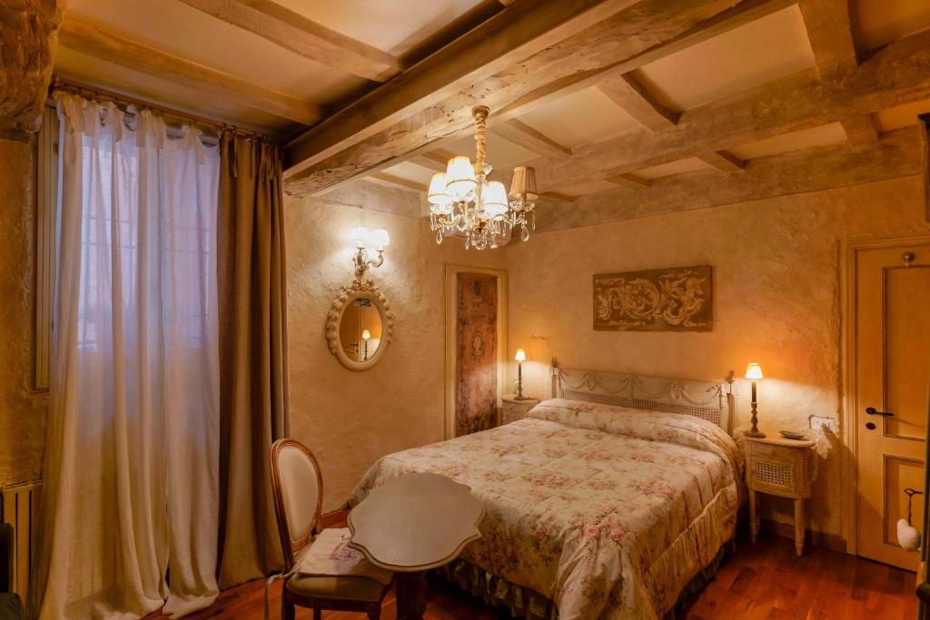 A bed or beds in a room at Gallery Guesthouse
