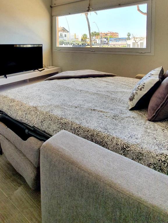 Postel nebo postele na pokoji v ubytování Playa Doñana 2