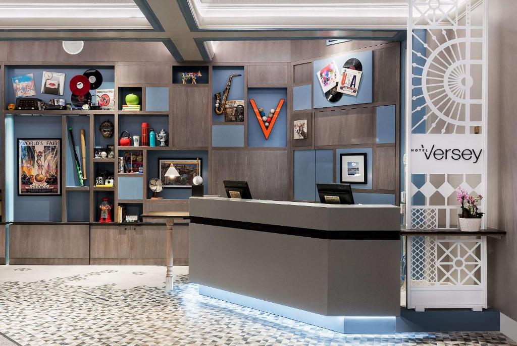 a lobby of a pharmacy with a reception desk at Hotel Versey Days Inn by Wyndham Chicago in Chicago