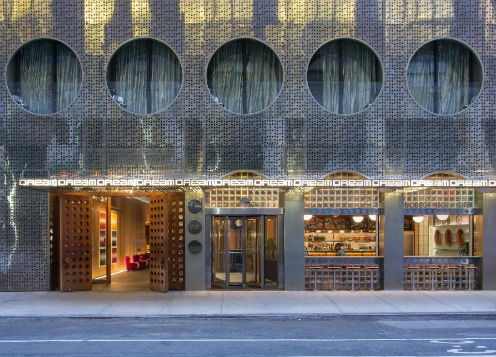 a store front of a building with many windows at Dream Downtown, by Hyatt in New York
