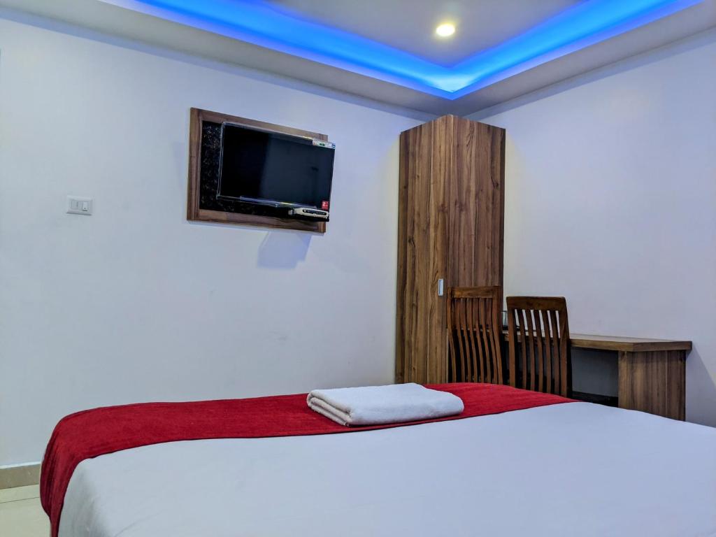 Postel nebo postele na pokoji v ubytování Hotel Feathers