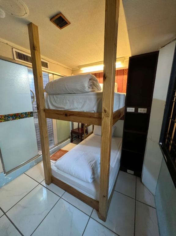 a couple of bunk beds in a room at Boston Hotel in Chiayi City